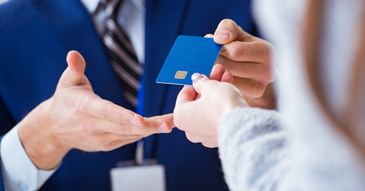 Person handing a man their credit card